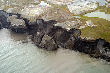 <a href="/earth/polar/cryosphere_permafrost1.html&edu=elem">Permafrost</a> is
ground that is below the freezing point of water (0C or 32F) for two
or more years. Permafrost is found at high latitudes like the
<a href="/earth/polar/polar_north.html&edu=elem">Arctic</a> and
<a href="/earth/polar/polar_south.html&edu=elem">Antarctic</a>.
It is also common at high altitudes - like mountainous areas wherever the
<a href="/earth/climate/cli_define.html&edu=elem">climate</a> is
cold. 
Permafrost has been thawing relatively quickly in recent years. Scientists
have found that the rate of permafrost thaw has increased because of <a href="/earth/climate/cli_effects.html&edu=elem">global
warming</a>.<p><small><em>Image courtesy of the    USGS</em></small></p>